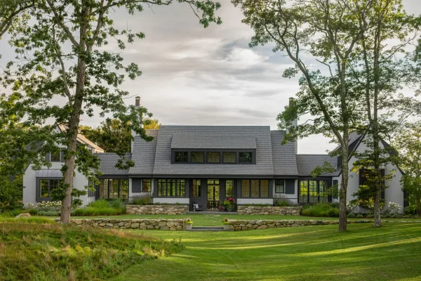 A modern homestead with a sprawling lawn and Enviroshake Aged Cedar roof
