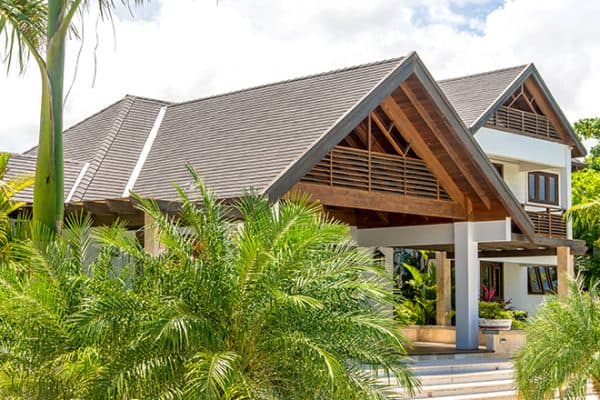 Tropical home with aged cedar shake roof