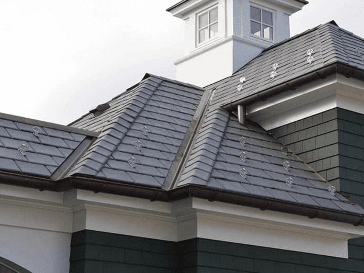 Enviroslate synthetic slate material installed on residential roof with aluminum snow guards.