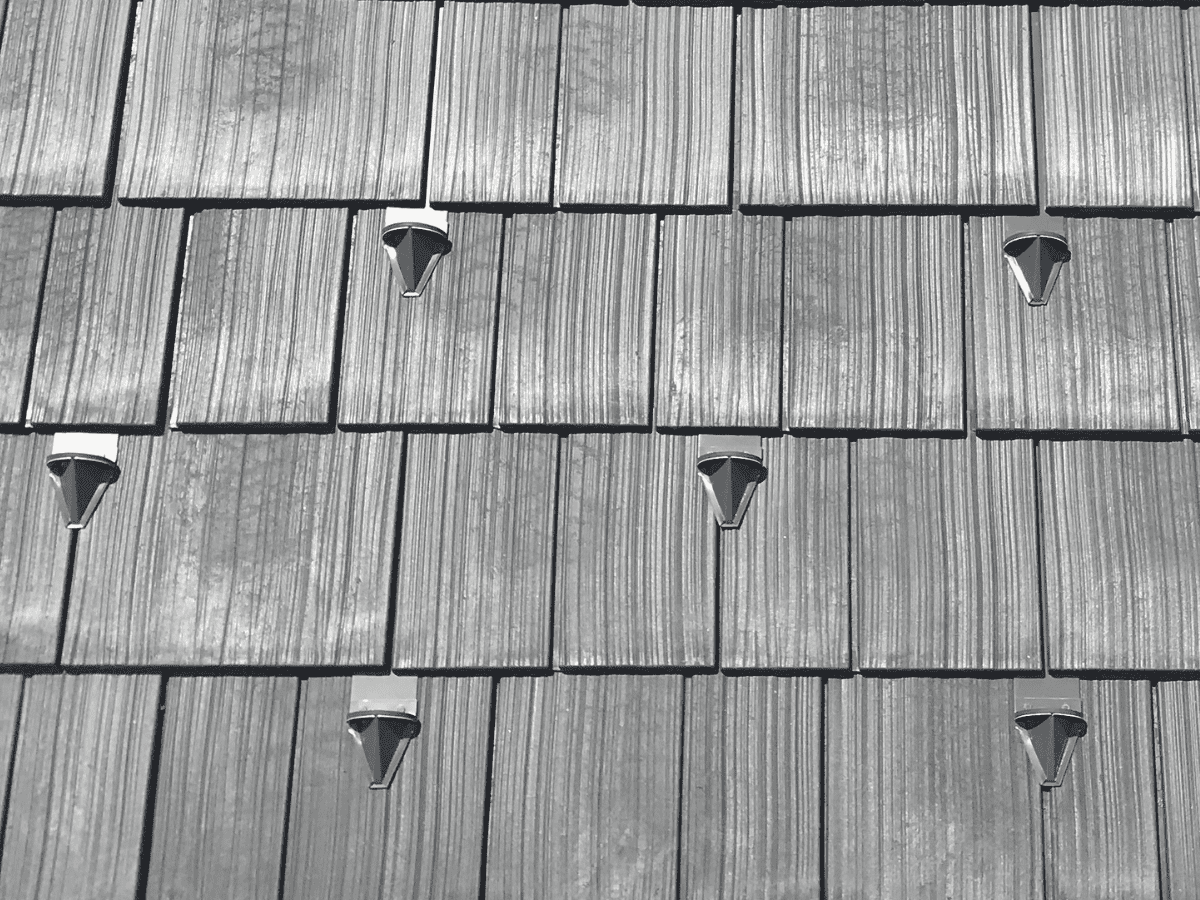 Closeup swatch of the Enviroshake composite roof with aluminum snow guards.