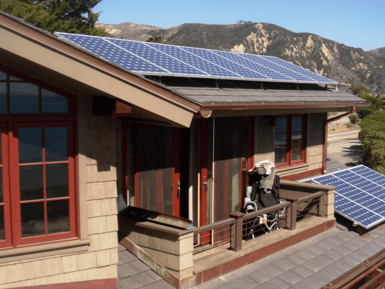Luxury residence with solar panels installed on Enviroshake synthetic shingle roofing system