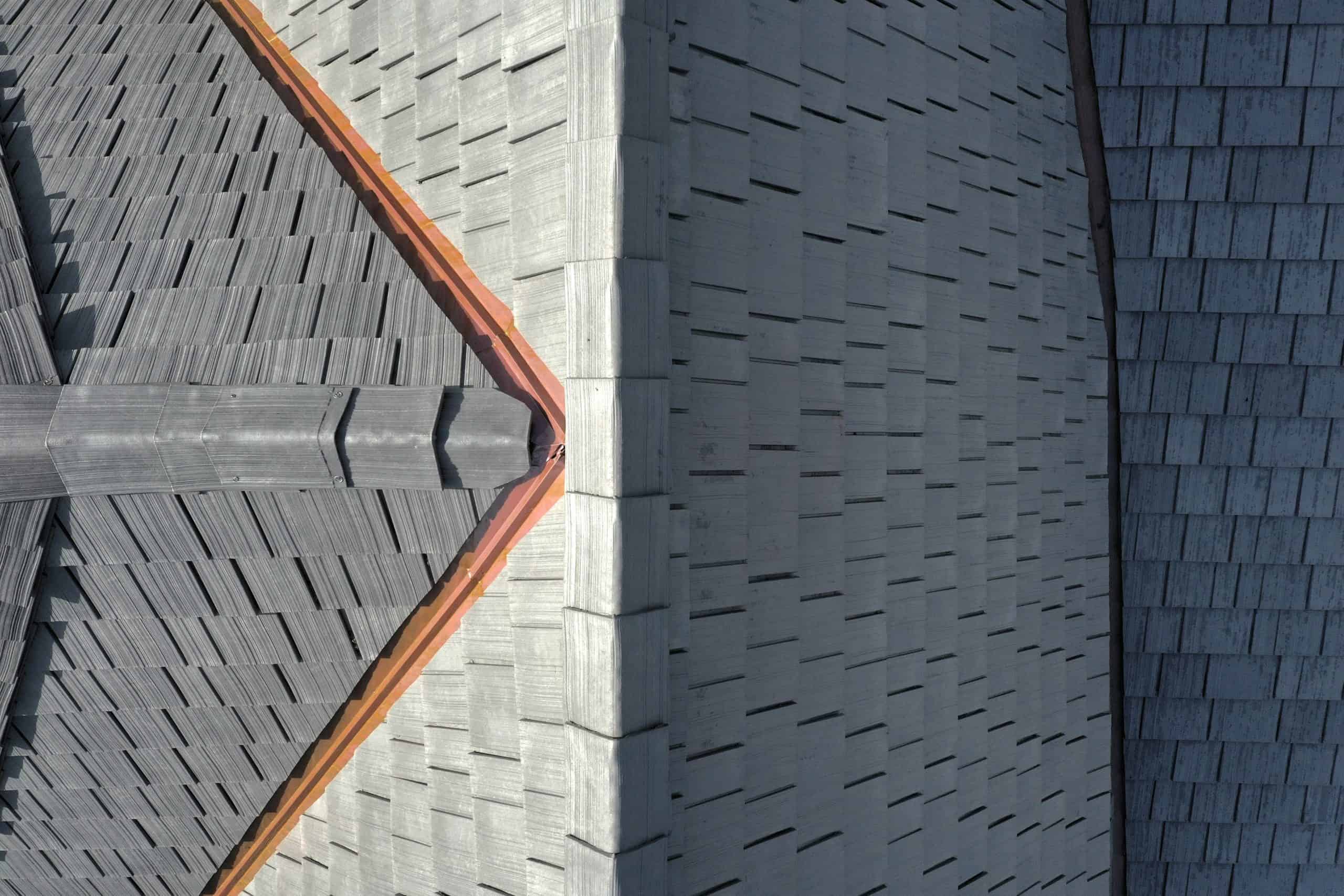 Top-down view of Enviroshake Silvered Cedar on a roof with copper flashing