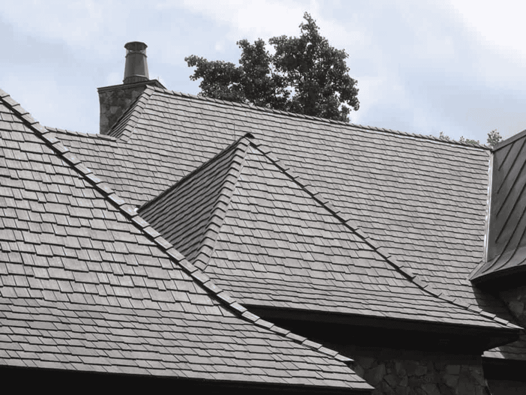 Staggered synthetic shake roofing on large home