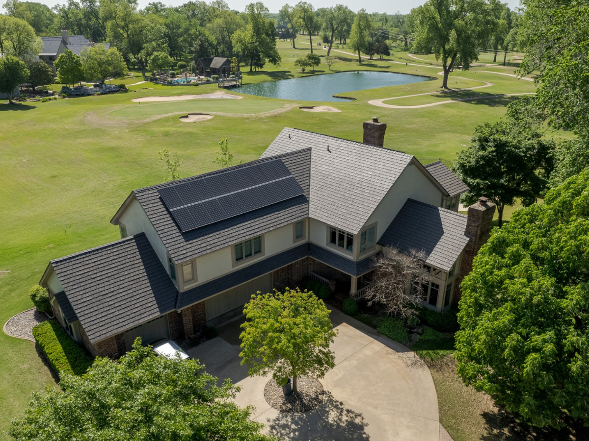 Solar panels installed on golf course home with Enviroshake roofing