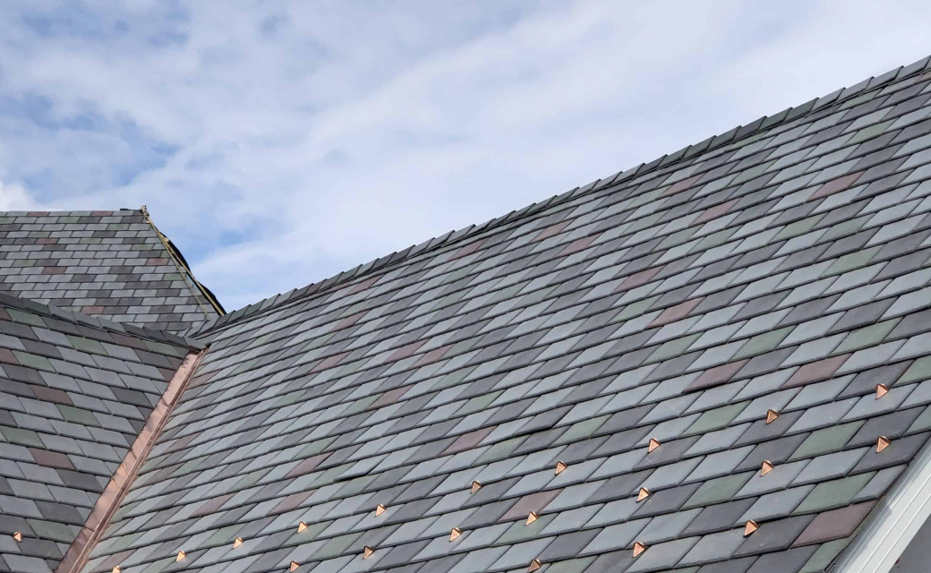 Closeup of Enviroslate synthetic slate roof in multiple colours