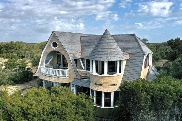 House with turret roof feature surrounded by greenery - Enviroshake Silvered Cedar