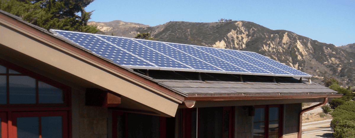Luxury residence with solar panels installed on Enviroshake synthetic shingle roofing system